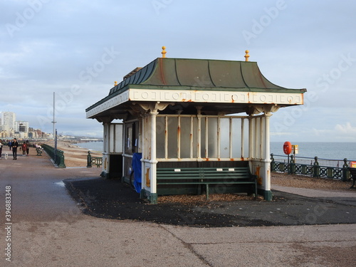 A shelter with benches by the sea