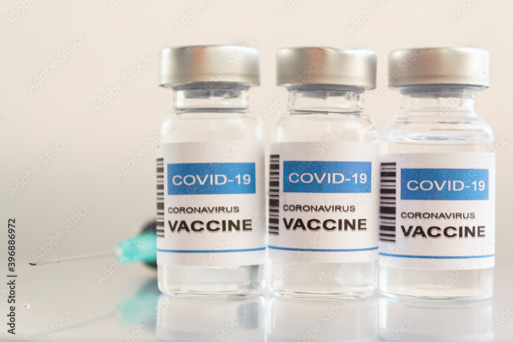 Syringe and Covid-19 coronavirus vaccine Syringe and Covid-19 coronavirus vaccine