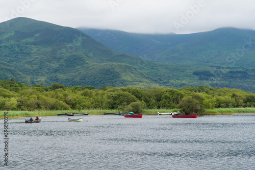 Ross lake, boats and kayaks, Killarney National Park, County Kerry, Ireland near Castle Ross. Wild Atlantic Way, Ring of Kerry, selective colors