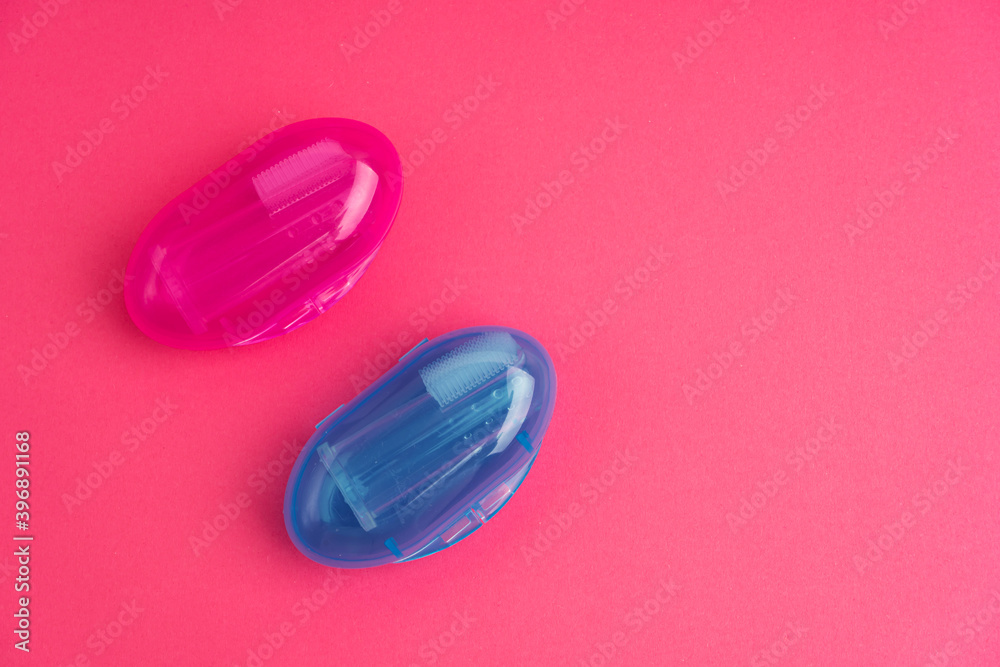 Compact toothbrush fingertip. Travel hygiene close up Compact toothbrush fingertip. Travel hygiene close up