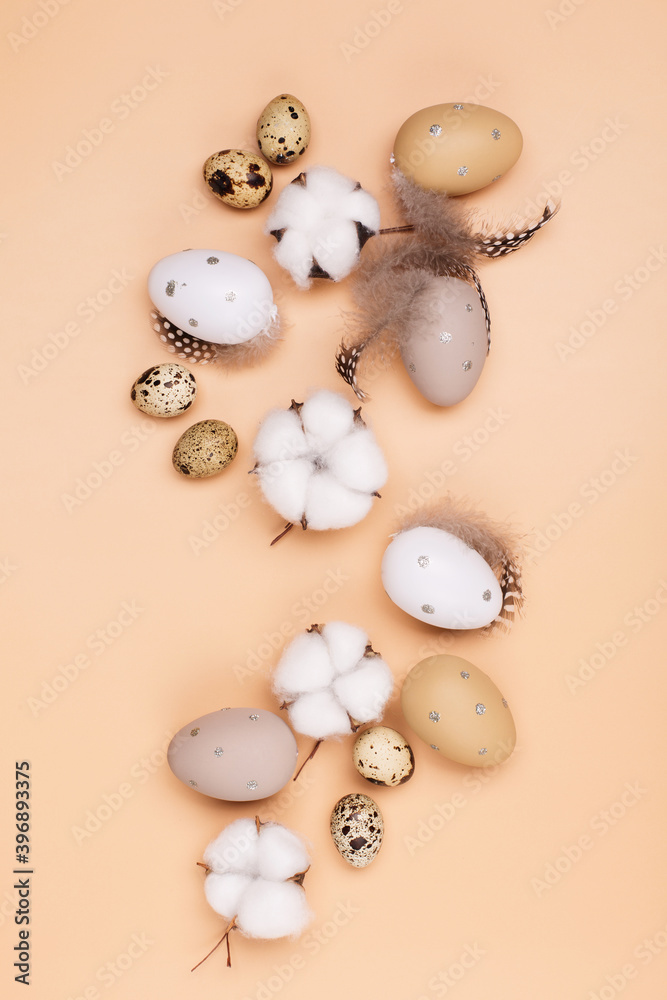 Easter eggs on beige pastel background with space for text. Flat lay image composition, top view. Easter eggs on beige pastel background with space for text. Flat lay image composition, top view.