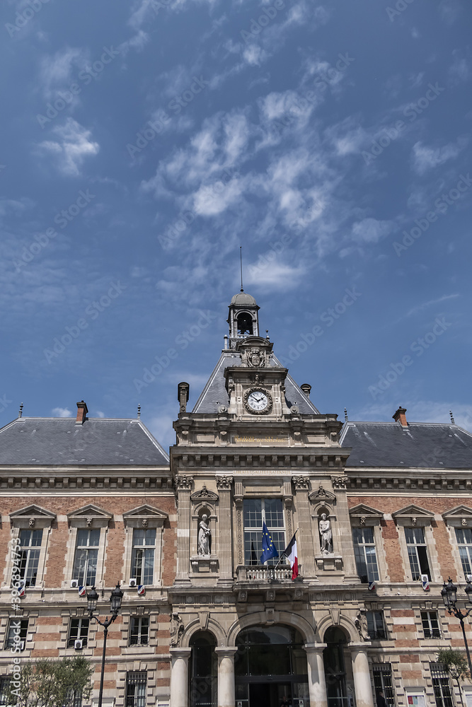 Architectural fragments of XIX arrondissement City hall (inscription: Mairie du XIX Arr, 1878) in Paris. XIX arrondissement called Butte-Chaumont, situated on right bank of River Seine. Paris, France.