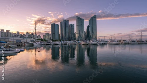 Wallpaper Mural Time Lapse Sunrise of Busan Marina city skyscrapers with reflection in water, South Korea. Torontodigital.ca
