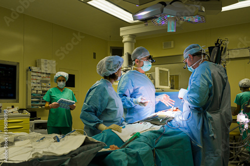 Surgeons in the operating room do operation