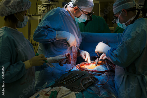 Surgeons in the operating room do operation