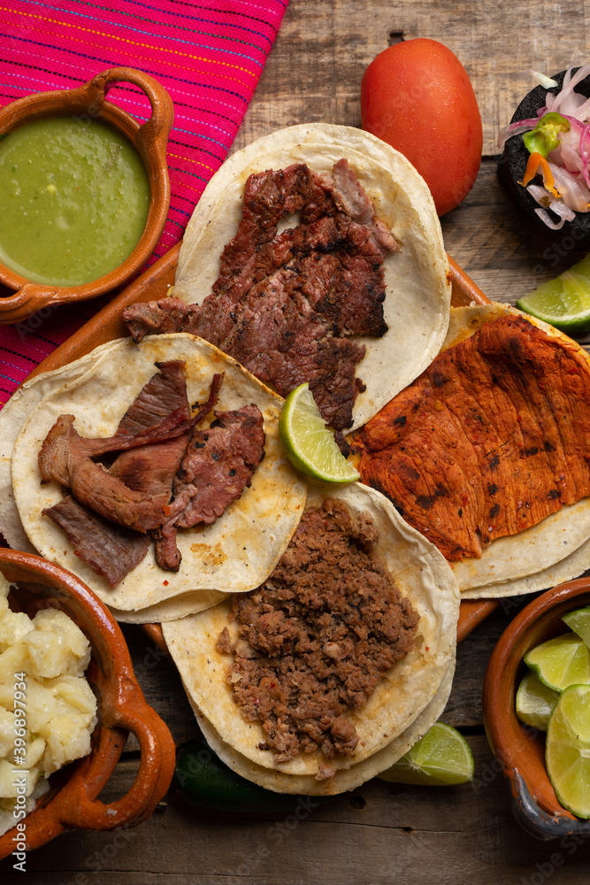 Assortment of mexican tacos on wooden background Assortment of mexican tacos on wooden background