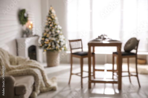 Blurred view of festive living room interior with Christmas tree © New Africa