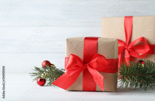Gift boxes and Christmas decorations on white table  space for text