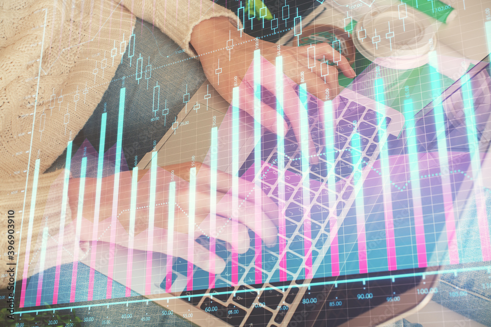Double exposure of woman hands typing on computer and forex chart hologram drawing. Stock market invest concept. Double exposure of woman hands typing on computer and forex chart hologram drawing. Stock market invest concept.