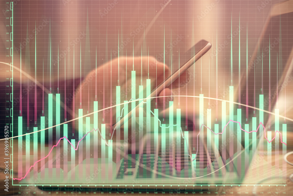 Double exposure of man's hands holding and using a phone and financial graph drawing. Analysis concept. Double exposure of man's hands holding and using a phone and financial graph drawing. Analysis concept.