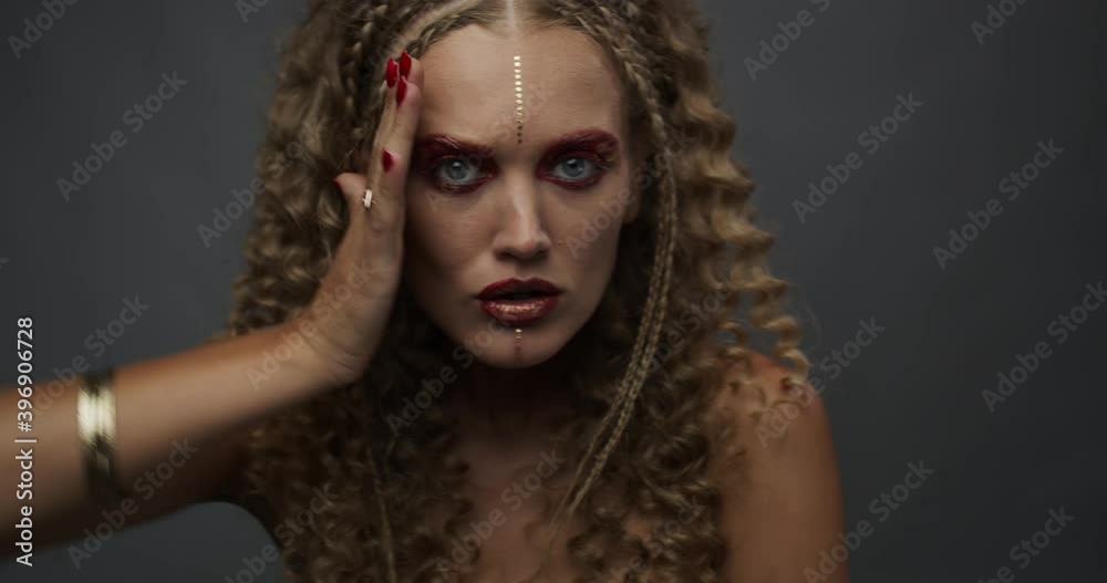 Sexy blonde model with blue eyes and bright makeup is posing in the studio, 4k Sexy blonde model with blue eyes and bright makeup is posing in the studio, 4k