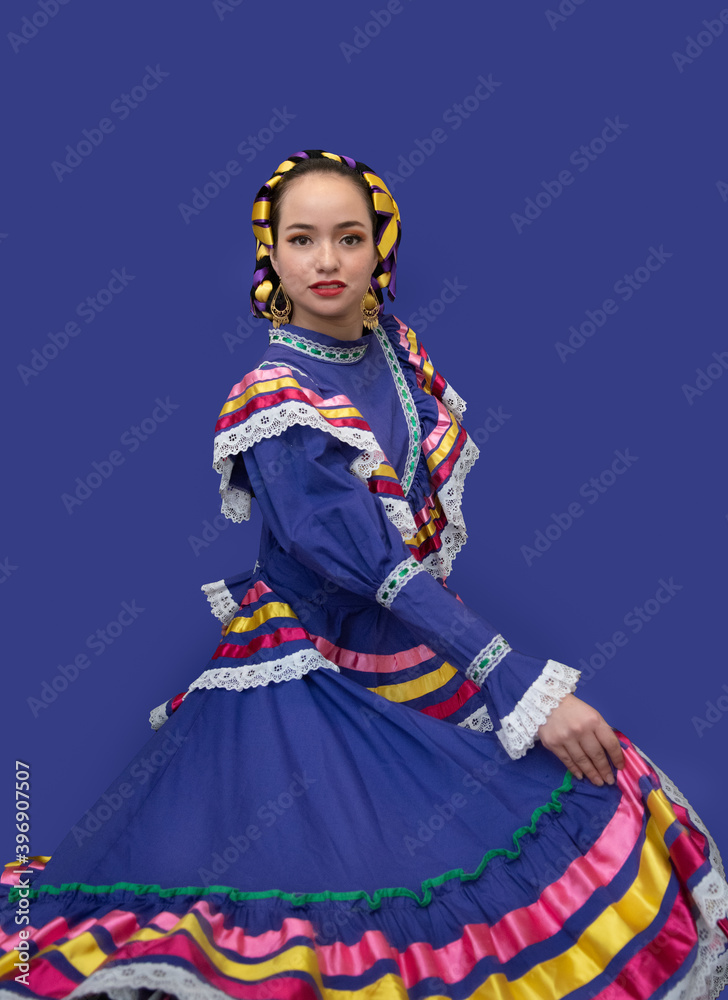 mexican latin woman with traditional folk costume with multicolored background, dancer and mexican model posing traditional folk clothing