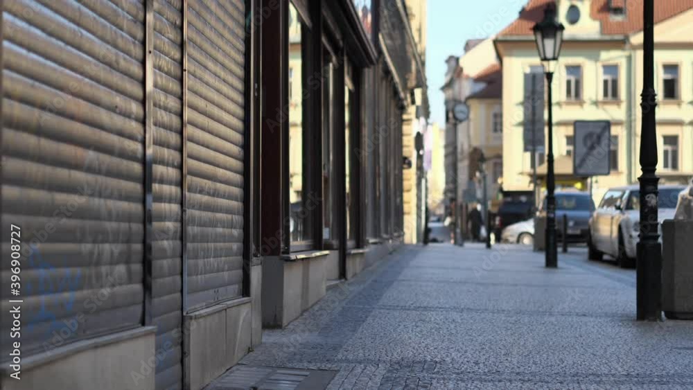 Closed Shops and Empty Sidewalk in Downtown Prague, Czech Republic. Covid-19 Virus Global Pandemic and Lockdown, Slow Motion Closed Shops and Empty Sidewalk in Downtown Prague, Czech Republic. Covid-19 Virus Global Pandemic and Lockdown, Slow Motion