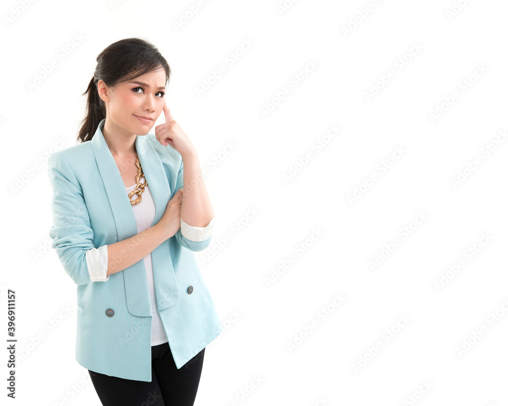Happy confident asian woman pointing finger up to her face and thinking on white background Happy confident asian woman pointing finger up to her face and thinking on white background