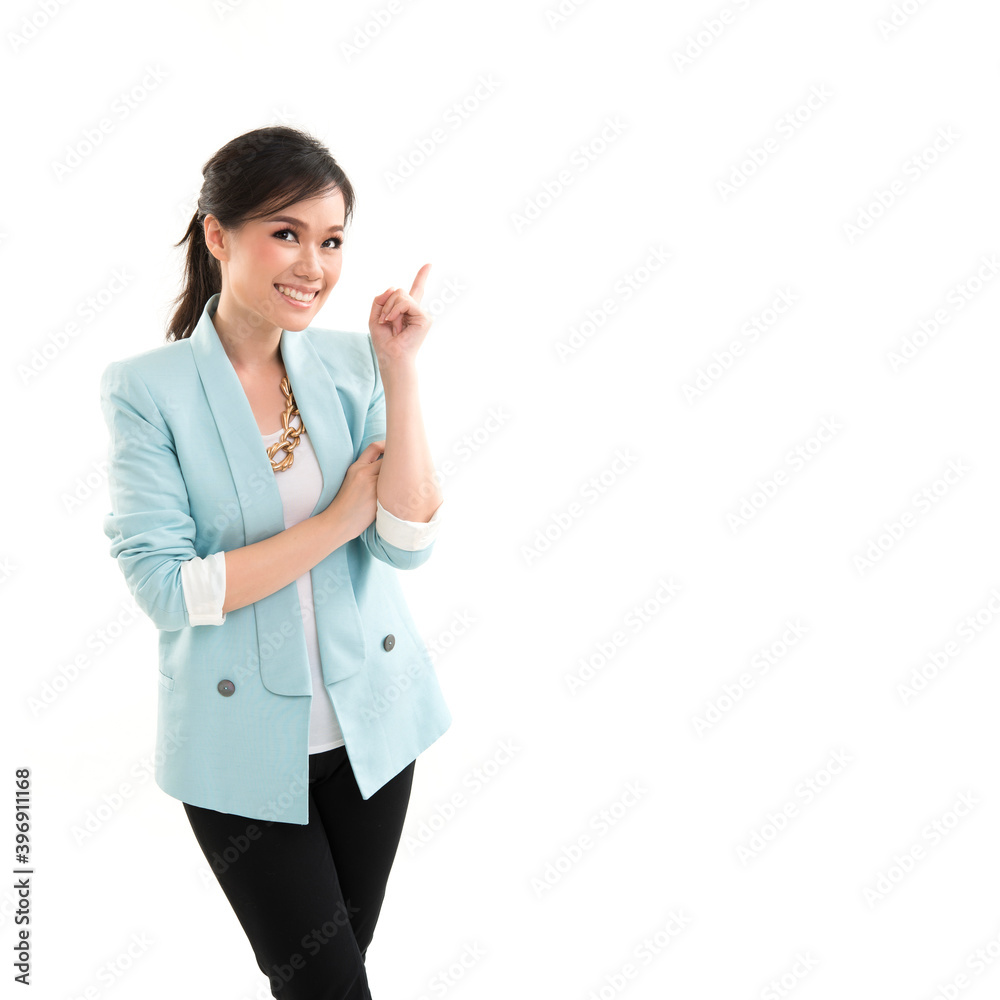 Happy confident asian woman pointing finger up on white background Happy confident asian woman pointing finger up on white background