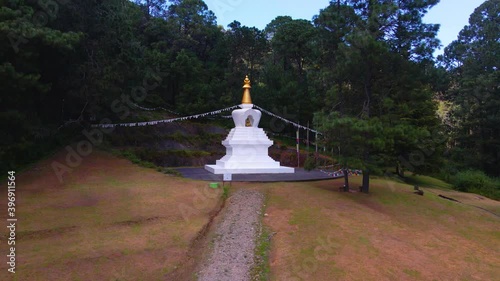 Aerial view towards the Stupa de la Paz monument, in Valle Bravo, Mexico - dolly, drone shot photo