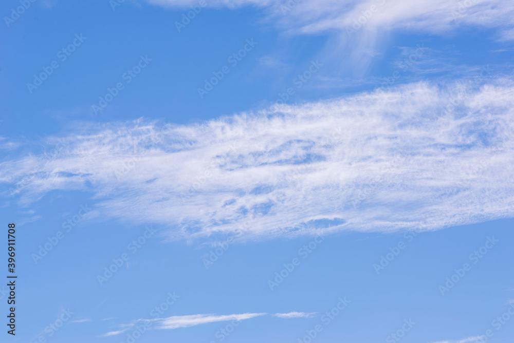 White clouds in a blue sky.