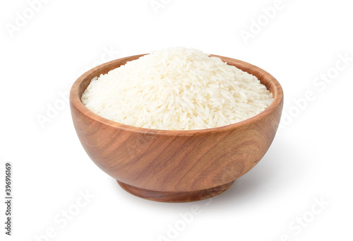 White jasmine rice in wooden bowl isolated on white background. Clipping path.