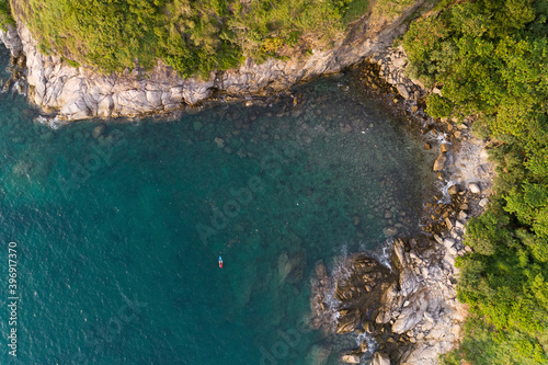 High angle view Tropical sea with wave crashing on seashore and high mountain located in Phuket Thailand aerial view drone top down Amazing nature view © panya99