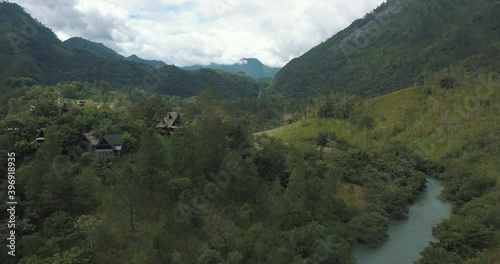 Drone aerial rising shot of tropical valley, mountains and river Cahabon in Guatemala photo