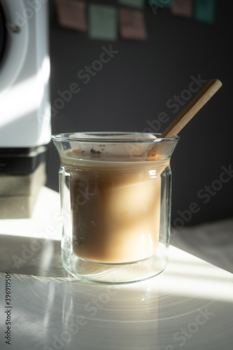 hot milk tea in clear glass cup afternoon sun
