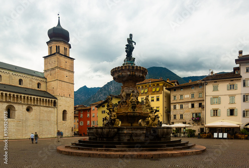 Cityscape of Italian Trento town with fountain in Baroque style