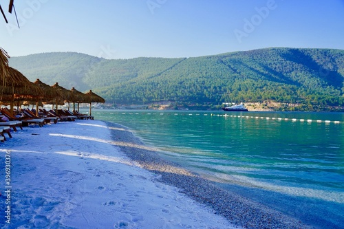 Paradise Sunny beach with white sand, palms and turquoise sea. Summer vacation and tropical beach concept. Slice of paradise. Lux concept