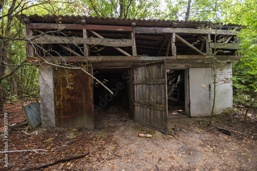 Garage in abandoned village of Chernobyl zone