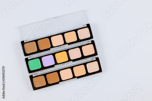 Eyeshadows palette of multicolor cosmetic make up on a isolated white background Fototapeta