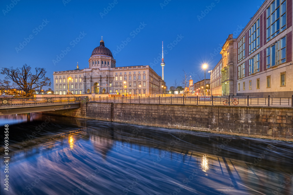 The reconstructed Berlin Palace with the Television Tower at the blue hour