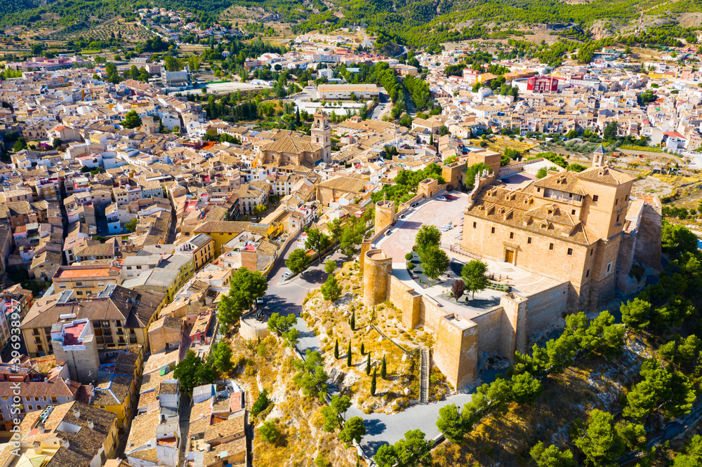 View from drone of houses old town of Caravaca de la Cruz at sunny day, Andalusia, Spain