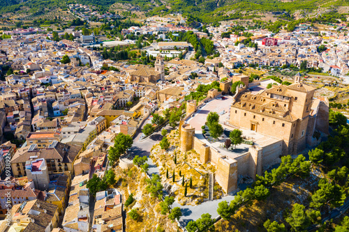View from drone of houses old town of Caravaca de la Cruz at sunny day, Andalusia, Spain