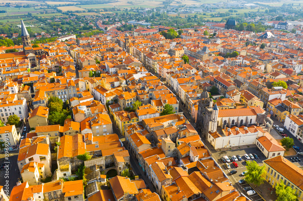 General aerial view of French commune of Riom on summer day, Puy-de-Dome, Auvergne, France