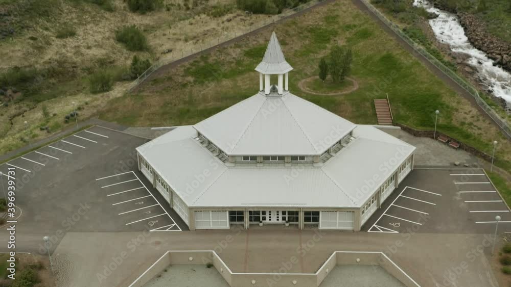 Aerial of small community church of fishing town Eskifjordur, house of worship