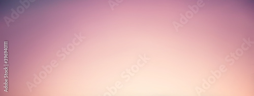 Warm light radiant from middle bottom on gradient purple banner background