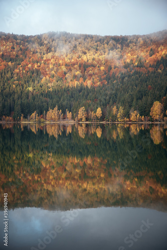 Lake fog sunrise with Autum...