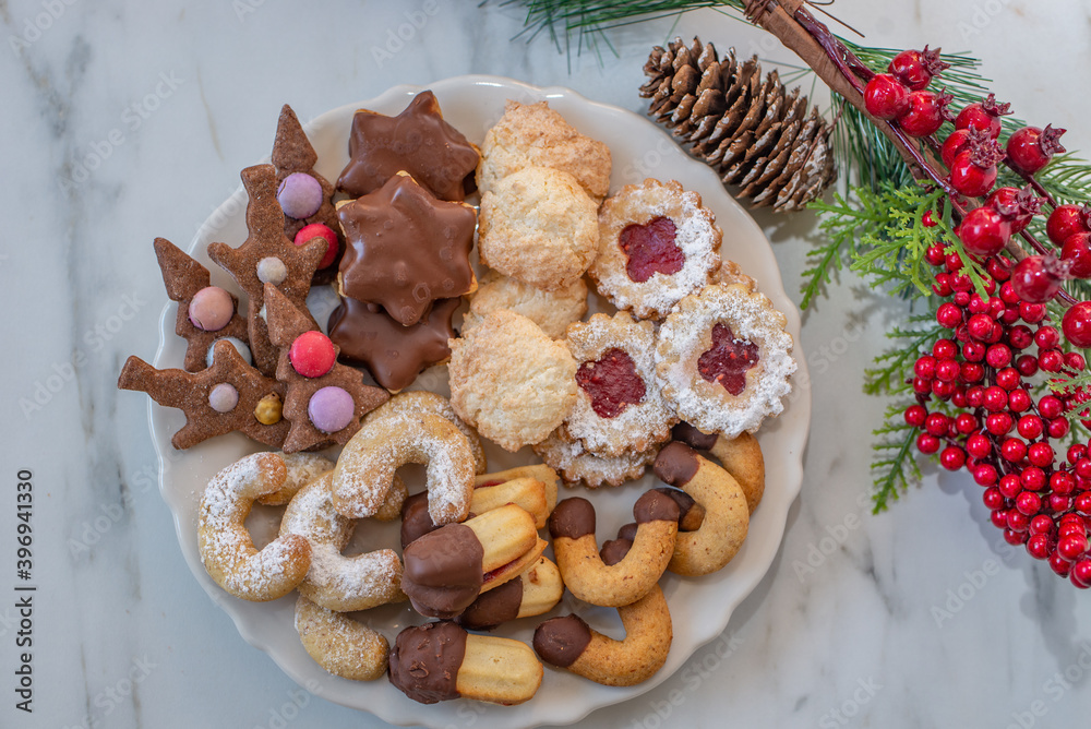 Traditional home made German Christmas Cookies on a festive table Traditional home made German Christmas Cookies on a festive table