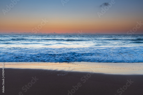 Fototapeta Naklejka Na Ścianę i Meble -  Hazy sunrise seascape with low swell