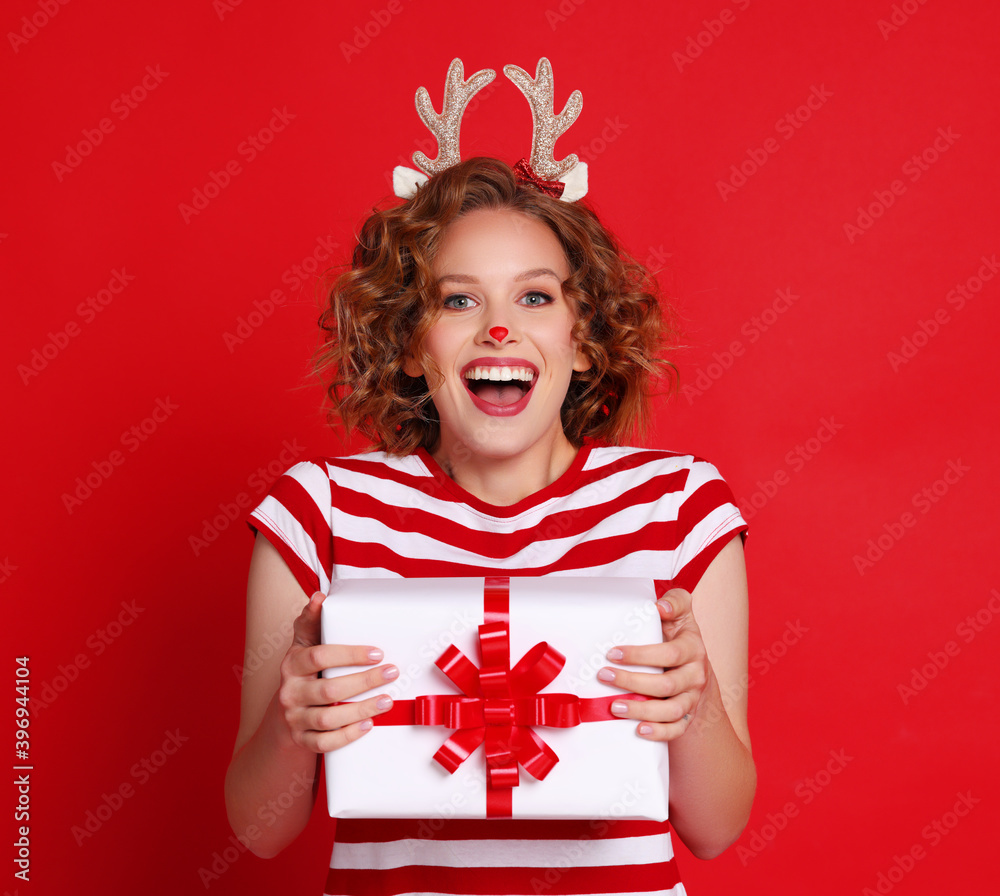 Cheerful female showing Christmas gift Cheerful female showing Christmas gift
