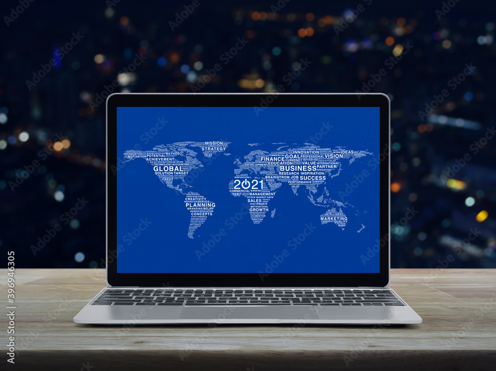 Start up 2021 business icon with global words world map with modern laptop computer on wooden table over blur colorful night light office city tower and skyscraper, Happy new year 2021 global business Start up 2021 business icon with global words world map with modern laptop computer on wooden table over blur colorful night light office city tower and skyscraper, Happy new year 2021 global business