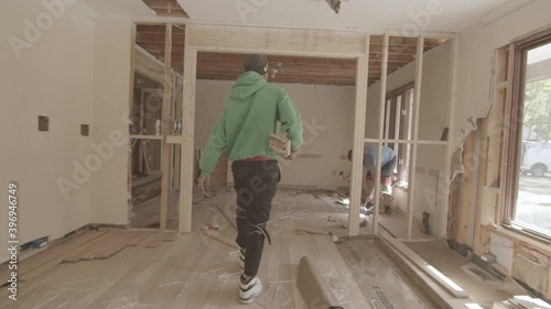 Worker walks through construction site