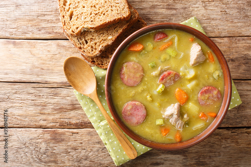 Obraz na płótnie Classic Dutch pea soup erwtensoep, snert closeup in the plate on the table