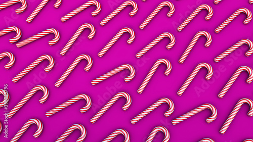 3D illustration of many colorful candy canes. Top view, pink background.