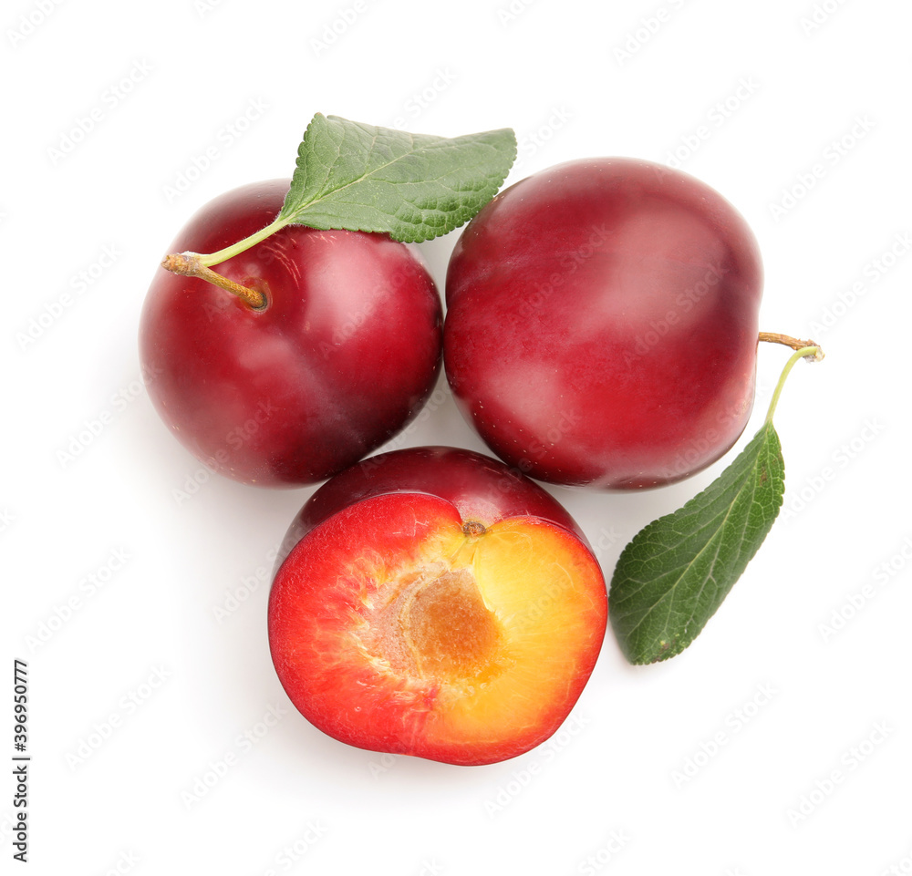 Fresh ripe plums isolated on white background