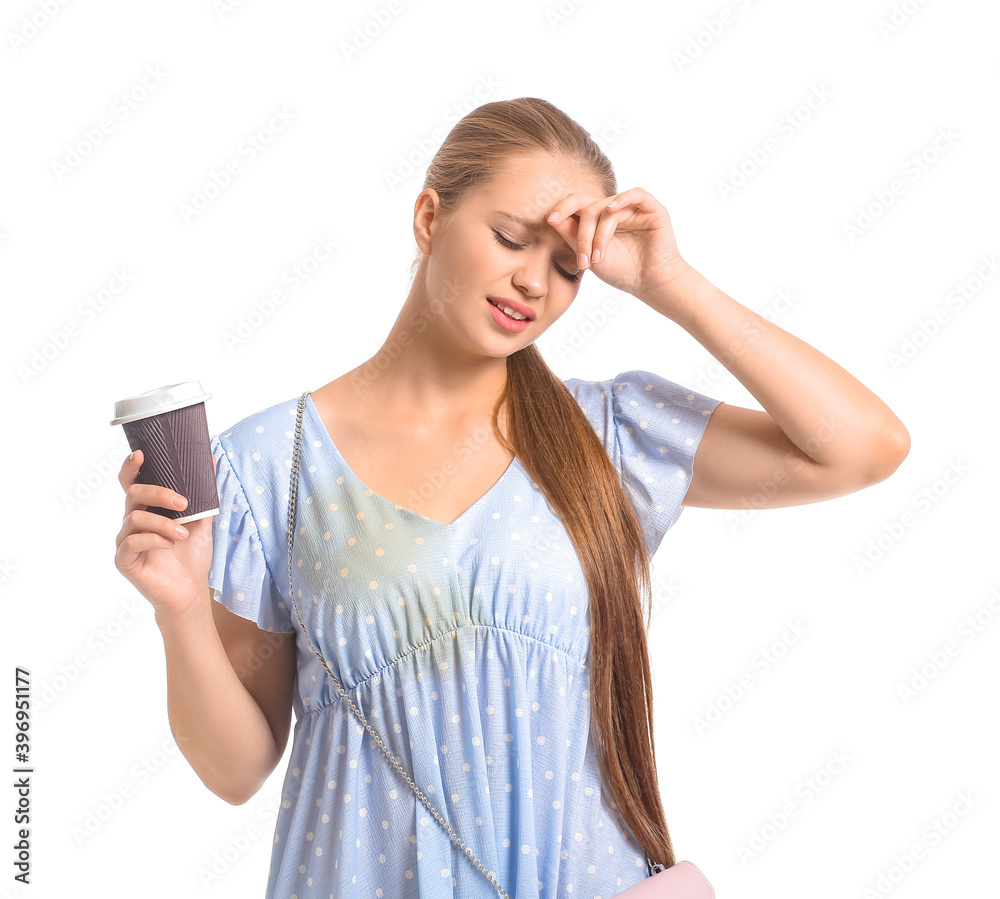 Troubled young woman with coffee stains on her dress on white background