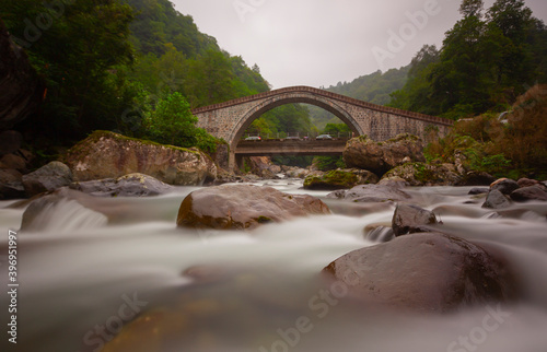 Artvin Arhavi double arches Bridges known as cifte kopruler with natural forest and blue sky background. photo