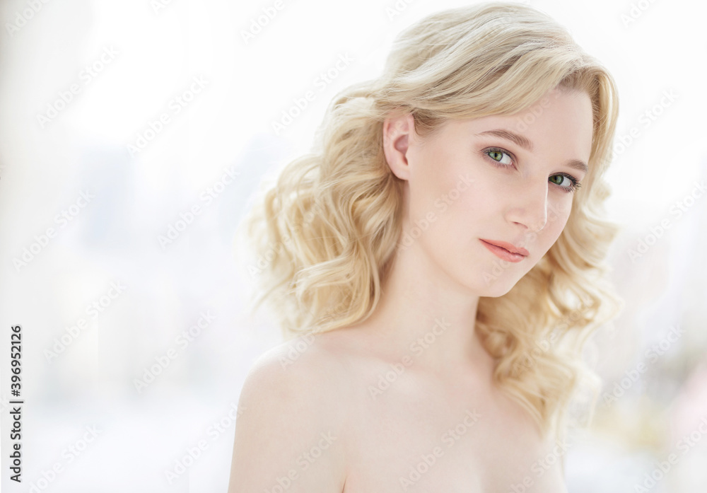Beautiful young girl with good skin on light background Beautiful young girl with good skin on light background
