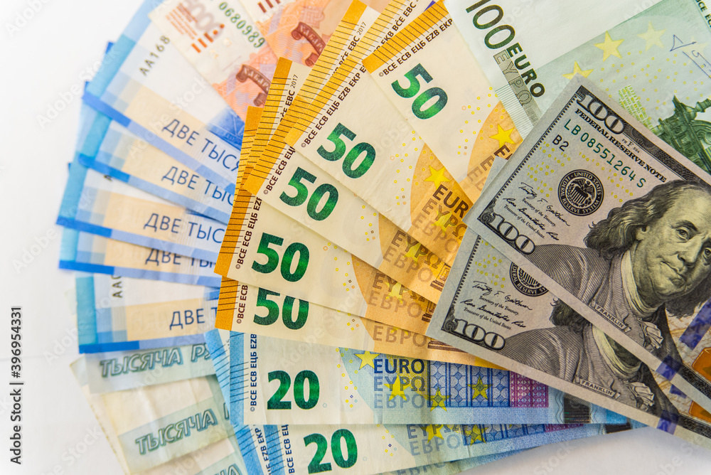 Paper notes of Euro, dollar and Russian rubles. Exchange rate. Buy currency sign. Exchange money. Dollar money cash. Investment concept Paper notes of Euro, dollar and Russian rubles. Exchange rate. Buy currency sign. Exchange money. Dollar money cash. Investment concept