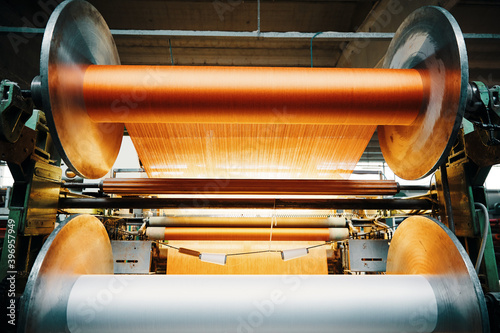 Textile factory machine weaving close up photo