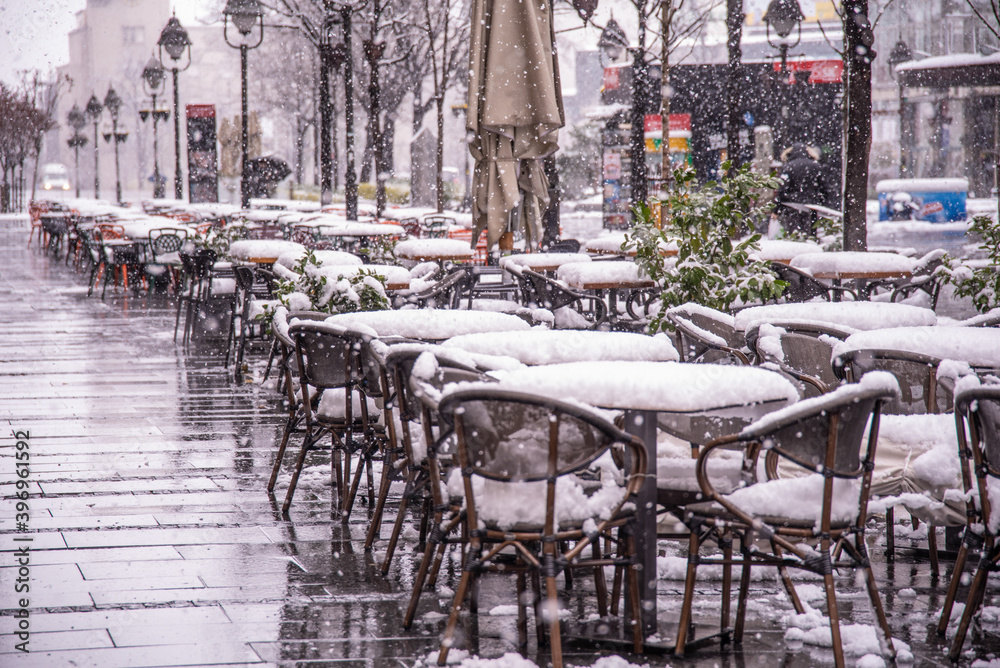 Restaurants closed on a snowy day during city lockdown caused by corona virus covid-19 pandemic. Belgrade, Serbia